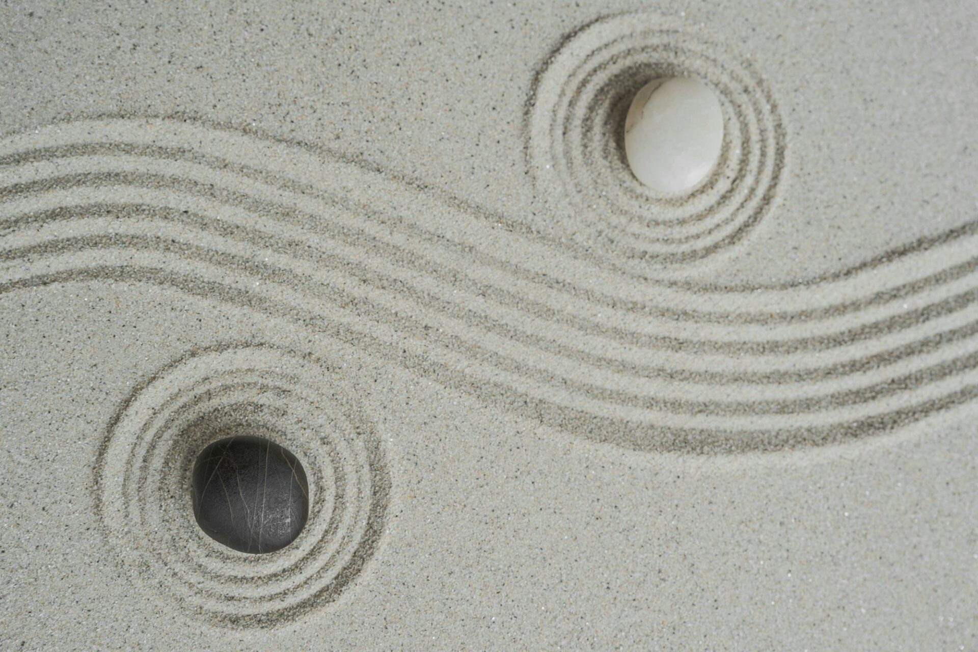 Zen stone Japanese black on sand round ripples, Meditation of Zen Buddhism traditional, Yin Yang