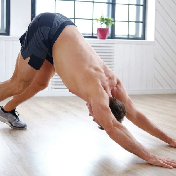 A man doing stomach workouts on the floor.